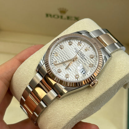 Rolex Datejust 36 126231G Silber geriffelte Oyster 2024