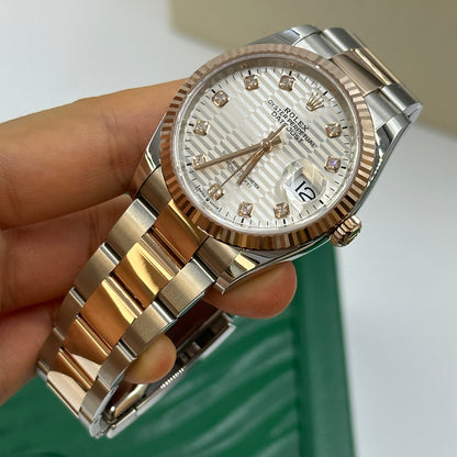 Rolex Datejust 36 126231G Silber geriffelte Oyster 2024